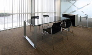 Table and chairs in an office with a wooden floor